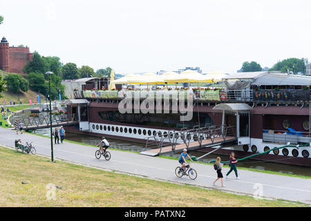 Large boat moored up on the river Vistula Krakow being used as a Restaurant and bar, Krakow, Poland, Europe. Stock Photo