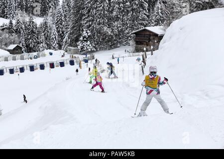 BAD HOFGASTEIN, AUSTRIA - MARCH 7, 2016: Children learn at skiing school in Bad Hofgastein. It is part of Ski Amade, one of largest ski regions in Eur Stock Photo