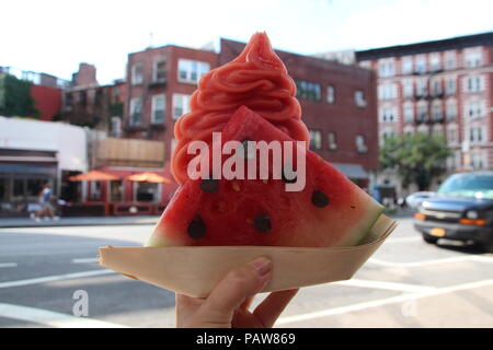 New York, USA. 18th July, 2018. The new 'What-A-Melon' ice cream by confectioner D. Ansel. The inventor of the 'Cronut' has doubled down with two new ice cream creations. The watermelon ice cream comes in a piece of actual watermelon and the seeds are bits of bitter chocolate. Credit: Christina Horsten/dpa/Alamy Live News Stock Photo