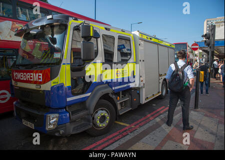 Morden Underground Station, London, UK. 25 July, 2018. Southern terminus station on the Northern Line is closed at 08.20am during the peak of the morning rush hour due to a reported fire incident in the south bound tunnel. All trains to and from Morden stopped while the incident was investigated, with large build up of passengers outside the station. Credit: Malcolm Park/Alamy Live News. Stock Photo