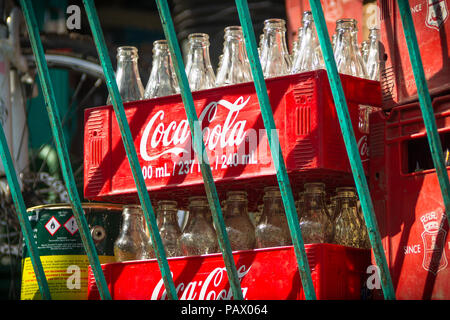 Red Cases of Coca-Cola bottles delivered as stock to traditional Filipino convenience store, known as sari sari - Cebu City, Philippines Stock Photo