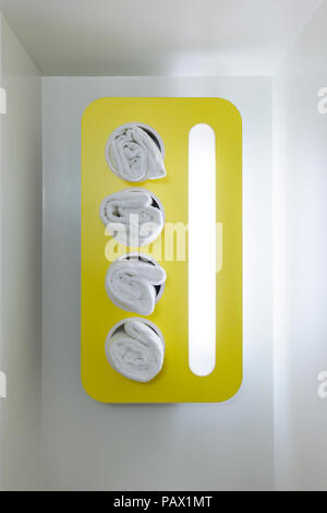 A modern retro style towel rack in a hotel bathroom. Stock Photo