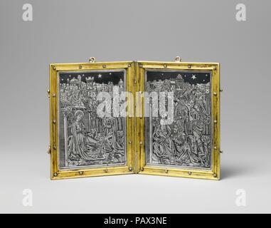 Devotional Diptych with the Nativity and the Adoration. Culture: French. Dimensions: Overall: 5 1/2 x 8 3/16 x 1/4in. (13.9 x 20.8 x 0.7cm)  closed: 5 1/2 x 4 3/16 x 1/2 in. (13.9 x 10.6 x 1.3 cm). Date: ca. 1500.  The scenes on this diptych find an echo in the pages of a printed Book of Hours (acc. no. 20.53.3). It is perhaps not surprising that the same workshop should produce the designs used for both the book and the diptych: each is a small object, in black and white, meant to be held in the hands during private prayer. But the same workshop also produced cartoons for large-scale, colorfu Stock Photo