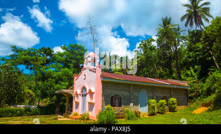 Historic Pink Spanish church in the Philippine jungle island of Catanduanes