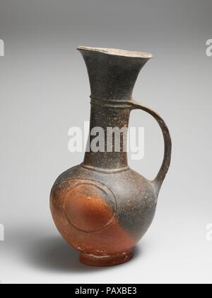 Terracotta jug. Culture: Cypriot. Dimensions: H. 11 3/16 in. (28.4 cm). Date: ca. 1600-1450 B.C..  Jug with funnel-shaped mouth, handle, and spiral bands in relief. Museum: Metropolitan Museum of Art, New York, USA. Stock Photo