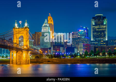 The Cincinnati skyline and Ohio River at night, seen from Covington, Kentucky, Stock Photo