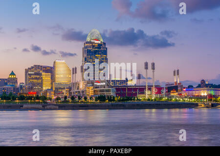 The Cincinnati skyline and Ohio River at night, seen from Covington, Kentucky, Stock Photo