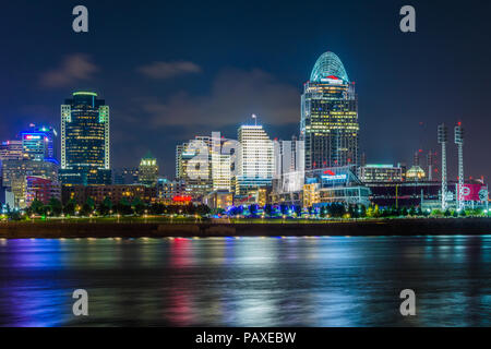 The Cincinnati skyline and Ohio River at night, seen from Covington, Kentucky, Stock Photo
