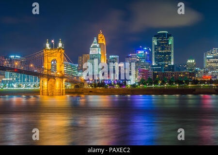 The Cincinnati skyline and Ohio River at night, seen from Covington, Kentucky, Stock Photo