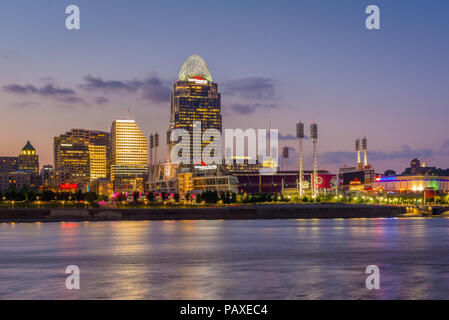 The Cincinnati skyline and Ohio River at night, seen from Covington, Kentucky, Stock Photo