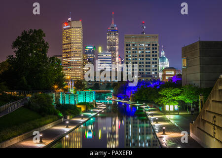 The Indiana Central Canal and downtown skyline at night in Indianapolis, Indiana Stock Photo