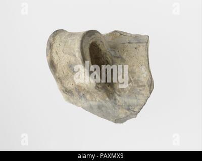 Terracotta rim and handle of a vase. Culture: Helladic. Dimensions: Other: 1 3/4in. (4.5cm). Date: ca. 2000-1550 B.C..  Fragment of a handle from a vase. Museum: Metropolitan Museum of Art, New York, USA. Stock Photo