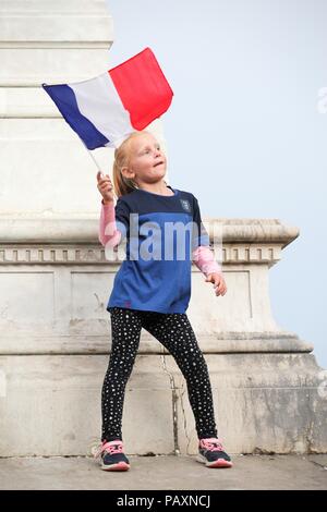 Macon, France - July 20, 2018: Young girl celebrating the win of the football World Cup title 2018 for the French team Stock Photo