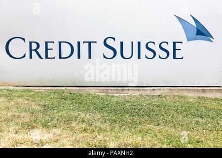Kirchberg, Luxembourg - July 21, 2018: Credit Suisse logo on a wall. Credit Suisse is a Swiss multinational financial services holding company, Stock Photo