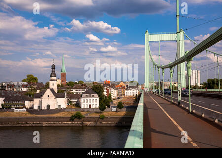 the Muelheimer bridge across the river Rhine, view to the church St. Clemens in the district Muelheim, Cologne, Germany.  die Muelheimer Bruecke ueber Stock Photo