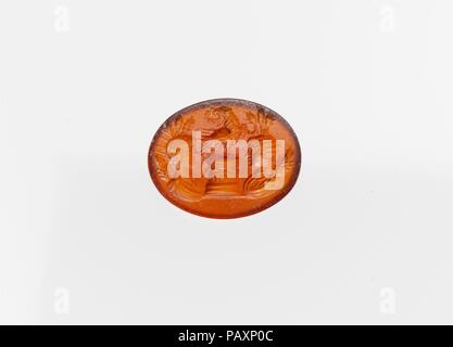 Carnelian ring stone. Culture: Roman. Dimensions: Length: 9/16 in. (1.5 cm). Date: ca. A.D. 177-192.  Male and female busts around an eagle on an altar. Museum: Metropolitan Museum of Art, New York, USA. Stock Photo