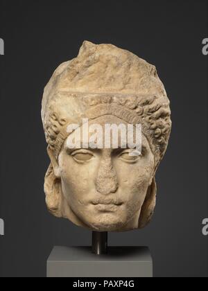 Over-life-sized marble portrait, probably of the empress Sabina. Culture: Roman. Dimensions: 14 3/4 in. (37.5 cm). Date: ca. A.D. 121-128.  This imposing head probably comes from a statue of Sabina, wife of the emperor Hadrian. The face was originally surmounted by a very high, ovoid hairpiece covered with small curls, a style that was fashionable at the court of Trajan in about A.D. 100.  The upper part of the hairpiece was carved separately and added onto the shelf-like area above the forehead. In back, the hair is arranged like that of a classical statue of Venus, goddess of love, with long Stock Photo