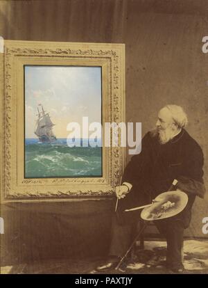 [Ivan Constantinovich Aivasovski]. Artist: Ivan Konstantinovich Aivazovsky (Russian, Feodosiya 1817-1900 Feodosiya). Dimensions: Image (inset oil painting): 10.6 × 7.3 cm (4 3/16 × 2 7/8 in.)  Image (Photograph): 25.7 × 19.3 cm (10 1/8 × 7 5/8 in.)  Mount: 43.8 × 34.8 cm (17 1/4 × 13 11/16 in.). Photography Studio: Babayeva Studio, Russian (Russian, active 1890s). Date: 1893.  The Russian Romantic artist Ivan Konstantinovich Aivazovsky (1817-1900) was widely renowned for his paintings of sea battles, shipwrecks, and storms at sea. Born into an Armenian family in the Crimean port city of Feodos Stock Photo