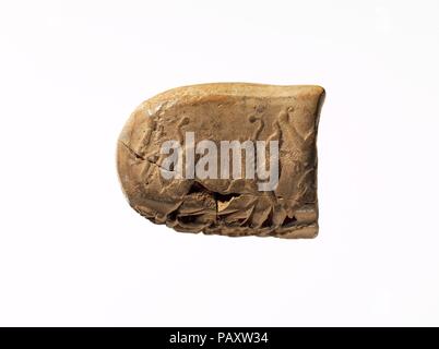 Cuneiform tablet impressed with seals: administrative document inscribed in Achaemenid Elamite. Culture: Achaemenid. Dimensions: 0.98 x 1.38 x .67 in. (2.49 x 3.51 x 1.7 cm). Date: ca. 500 B.C.. Museum: Metropolitan Museum of Art, New York, USA. Stock Photo