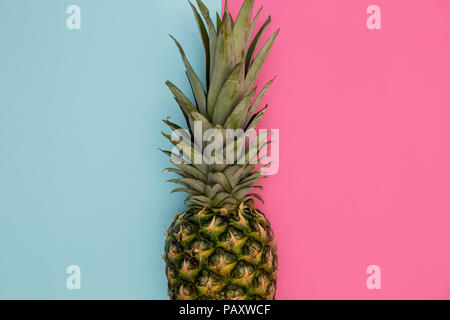 Pineapple fruit on bright pink background minimal summer food concept Stock Photo