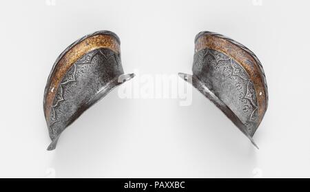 Two Ear Guards from a Shaffron (Horse's Head Defense) of Emperor Charles V (1500-1558). Armorer: Attributed to Desiderius Helmschmid (German, Augsburg, 1513-1579). Culture: German, Augsburg. Dimensions: 20.151.7; H. 5 3/8 in. (13.7 cm); W. 2 3/4 in. (7 cm), Wt. 2 oz. (47 g); 20.151.8; H. 5 1/4 in. (13.3 cm); W. 2 7/8 in. (7.3 cm), Wt. 2 oz. (51 g). Date: 1544.  These detached ear guards belong to a shaffron from the most famous of Charles V's (1500-1558) armors, the so-called Mühlberg garniture (after the Battle of Mühlberg--April 24, 1547--at which the emperor wore parts of that armor). Dated Stock Photo