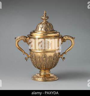 Two-handled cup with cover. Culture: British, possibly London. Dimensions: 14 1/2 × 6 3/4 in. (36.8 × 17.1 cm). Date: ca. 1730-60. Museum: Metropolitan Museum of Art, New York, USA. Stock Photo