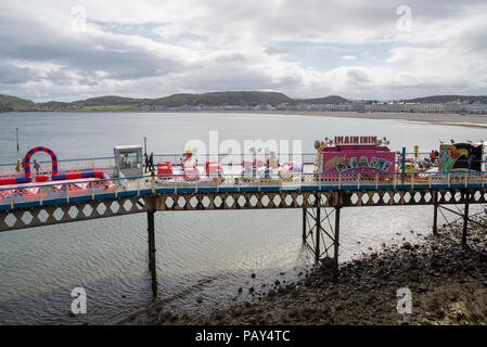 Childrens attractions on the pier at Llandudno, North Wales, UK. Stock Photo