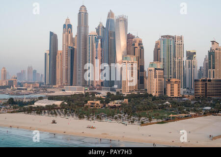 DUBAI, UAE - February 16, 2018: Aerial view of modern skyscrapers and beach at Jumeirah Beach Residence (JBR) during sunset in Dubai, UAE Stock Photo