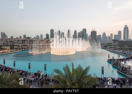 DUBAI, UAE - February 14, 2018:  The Dubai Fountain display in front of the Burj Khalifa, tallest building in the world, in downtown Dubai, UAE Stock Photo