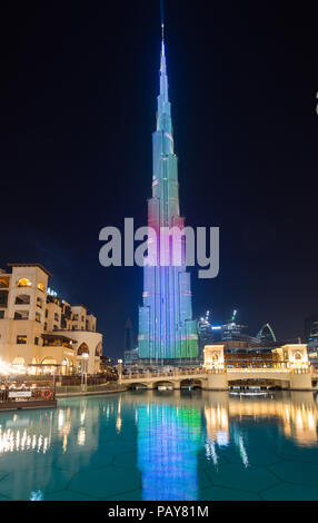 DUBAI, UAE - February 15, 2018: Burj Khalifa, with 828m height the tallest tower in the world, reflecting on the   Dubai Fountain lake outside the Dub