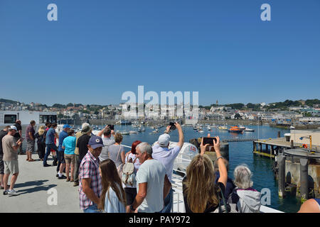 Ferry passengers arriving at St Peter Port, Guernsey, Channel Islands Stock Photo