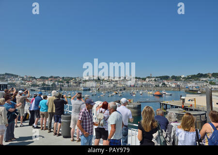 Ferry passengers arriving at St Peter Port, Guernsey, Channel Islands Stock Photo