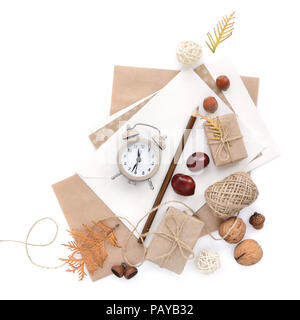 Autumn background with pencil, envelopes and an alarm clock. Top view. Space for your text. Stock Photo