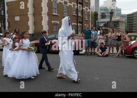 Young Catholics UK, take part in the annual procession around Clerkenwell in Honour of Our Lady of Mount Carmel UK. Italian communities annual religious festival a procession from Saint Peters, St Peters Italian Church Clerkenwell London people watching Central London UK 2018 2010s HOMER SYKES Stock Photo