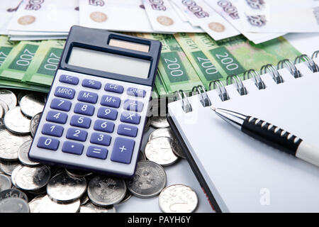 business still-life from a calculator and a bundle of russian banknote close up Stock Photo