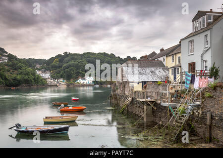 Properties back directly onto the waterfront at the picturesque little harbour at Fowey in East Cornwall made famous as the home of Daphne Du Maurier. Stock Photo