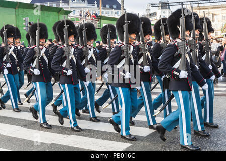 Copenhagen, Denmark - December 9, 2017: The procession of the royal guardsmen to the royal palace Amalienborg, accompanied by the orchestra. The cerem Stock Photo