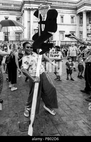 Anti Trump Protestors Holding Placards, Trafalgar Square, London, England Stock Photo