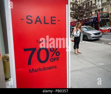 A sign in the Gap in New York on Sunday, July 15, 2018 advertises up to 70% off on merchandise in the chain's store. (Â© Richard B. Levine) Stock Photo