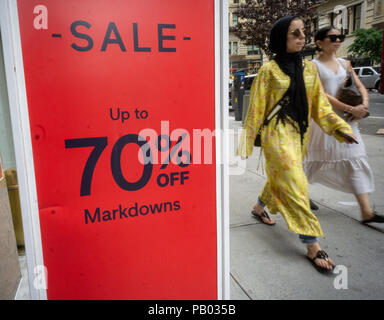 A sign in the Gap in New York on Sunday, July 15, 2018 advertises up to 70% off on merchandise in the chain's store. (Â© Richard B. Levine) Stock Photo