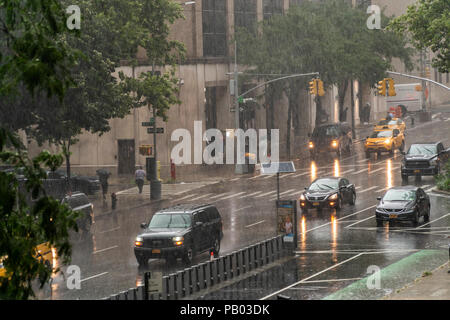 A torrential downpour disrupts the New York neighborhood of Chelsea on Tuesday, July 17, 2018. There is a flash flood warning in the city as a slow moving frontal system brings showers and thunderstorms to the New York region in the afternoon going into this evening. (Â© Richard B. Levine) Stock Photo