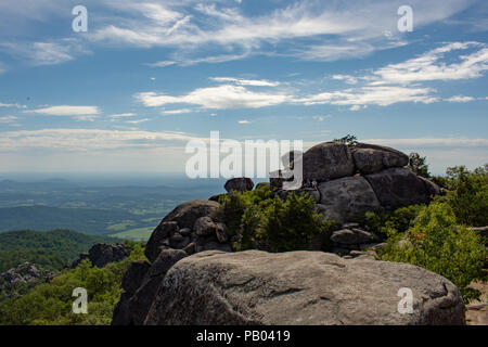 Wide angle shot of group of hikers at summit of Old Rag Mountain Stock Photo
