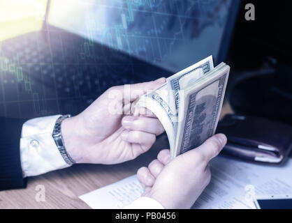 A man is sitting on dice and thinking about money on a white background. The concept of gambling. Probability theory. Lose in the casino. Bookmakers,  Stock Photo