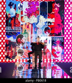 MIAMI BEACH, FL - JULY 14, 2018: An artist performs at the Luli Fama Collection during the Paraiso Fashion Fair at The Paraiso Tent Stock Photo