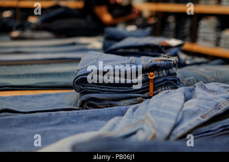 Jeans on the counter in the store. Fashion and shopping concept. Stock Photo