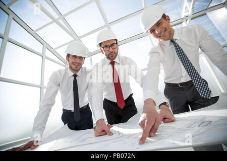 group of architects discussing sketches Stock Photo