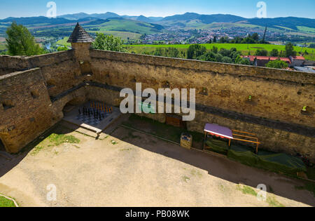 Stara Lubovna, Slovakia - AUG 28, 2016: inner courtyard of old medieval castle. popular tourist destination. big chess desk in the corner Stock Photo