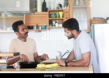 Two men preparing dinner Stock Photo
