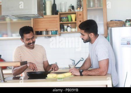 Two men preparing dinner Stock Photo