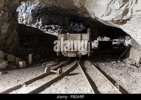 Mining trolley in a tunnel of an abandoned lime mine in Switzerland Stock Photo